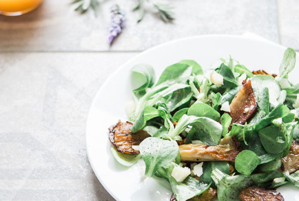 Plate of Pork Chops with Mixed Greens